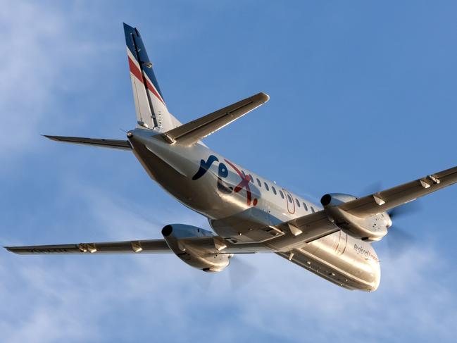 Adelaide, Australia - REX (Regional Express Airlines) Saab 340 twin engined regional commuter aircraft taking off from Adelaide Airport.Escape 15 October 2023Doc HolidayPhoto - iStock