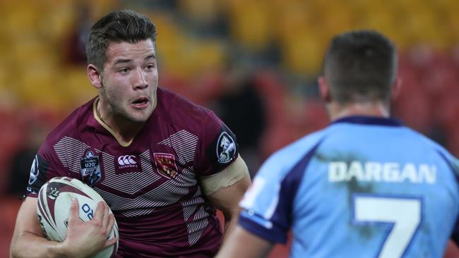 Patrick Carrigan looks to burst through the Blues defence during the under-20s match at Suncorp Stadium last year. Picture: Peter Wallis