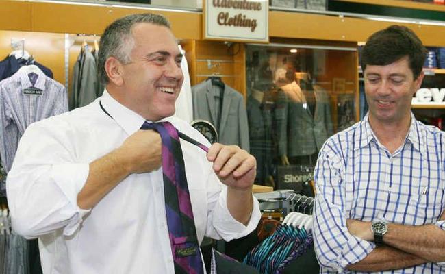 SUITING UP: Federal shadow treasurer Joe Hockey makes an emergency visit to Stewarts to buy a tie, after his luggage was lost. He is pictured here with LNP candidate for Capricornia Michelle Landry and Stewarts co-owner Mark Woods. Picture: Chris Ison