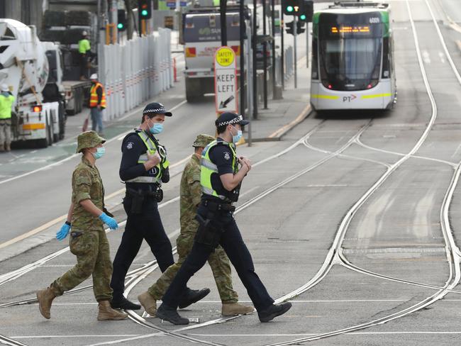 MELBOURNE, AUSTRALIA- NewsWire Photos AUGUST 26, 2020: Police and ADF patrol  Docklands in Melbourne which is very quiet during the stage four COVID-19 lockdown. Picture: NCA NewsWire/ David Crosling