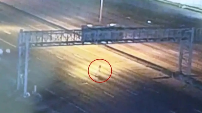 The gang then scaled a scaled a fence and were caught on video sprinting across a nearby interstate. Picture: WDSU.