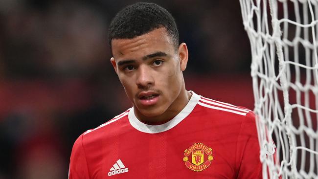 (FILES) In this file photo taken on January 3, 2022 Manchester United's English striker Mason Greenwood is substituted during the English Premier League football match between Manchester United and Wolverhampton Wanderers at Old Trafford in Manchester, north west England. - Manchester United forward Mason Greenwood was released on bail on February 2, 2022 pending further investigation into allegations of the rape and assault of a young woman, police said. Greater Manchester Police said in a statement: "A 20-year-old man arrested (on Sunday January 30 2022) on suspicion of the rape and assault of a woman has been released on bail pending further investigation." (Photo by Paul ELLIS / AFP) / RESTRICTED TO EDITORIAL USE. No use with unauthorized audio, video, data, fixture lists, club/league logos or 'live' services. Online in-match use limited to 120 images. An additional 40 images may be used in extra time. No video emulation. Social media in-match use limited to 120 images. An additional 40 images may be used in extra time. No use in betting publications, games or single club/league/player publications. /