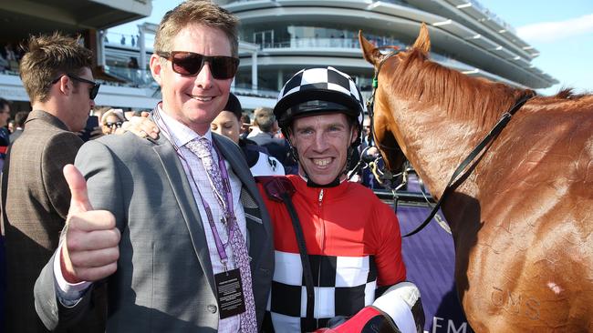 Trainer Jarrod McLean and jockey John Allen blew away many quaddie hopes when Trap For Fools won the Mackinnon Stakes. Pic: Michael Klein