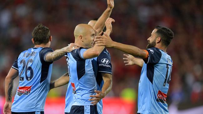 Sydney FC’s Adrian Mierzejewski celebrates scoring against Western Sydney Wanderers on Saturday night.