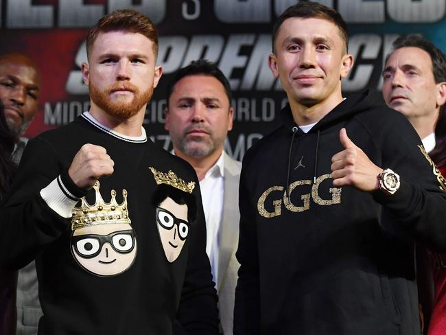 Canelo Alvarez (L) and Gennady Golovkin pose during a news conference.