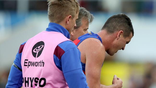 Tom Rockliff is helped from the ground following his shoulder injury. Picture: Getty Images