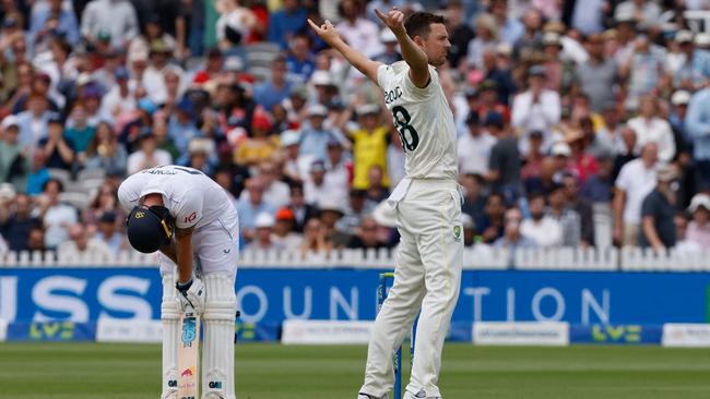 Josh Hazlewood (R) celebrates after taking the wicket of England's captain Ben Stokes (L) for 155 runs.