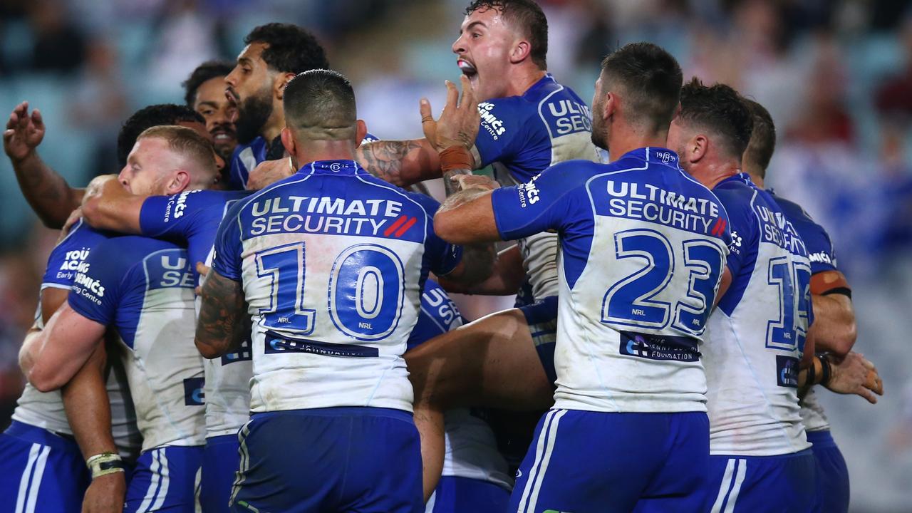 SYDNEY, AUSTRALIA - APRIL 30: Aaron Schoupp of the Bulldogs celebrates with teammates during the round eight NRL match between the Canterbury Bulldogs and the Sydney Roosters at Stadium Australia on April 30, 2022 in Sydney, Australia. (Photo by Jason McCawley/Getty Images)