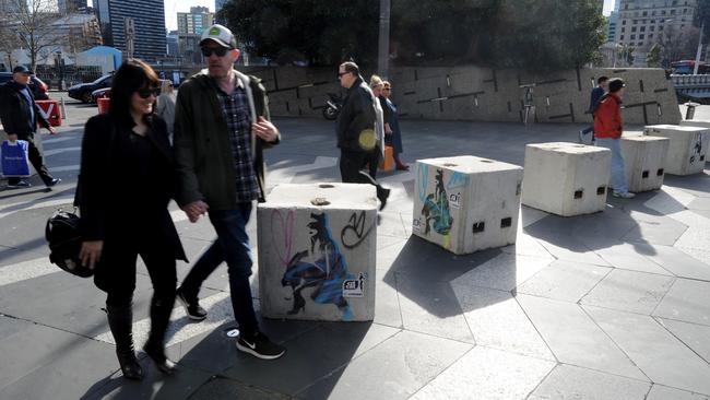 Melbourne hipsters may have decorated their new bollards, but that doesn’t mean they’re any less depressing. (Pic: Andrew Henshaw)