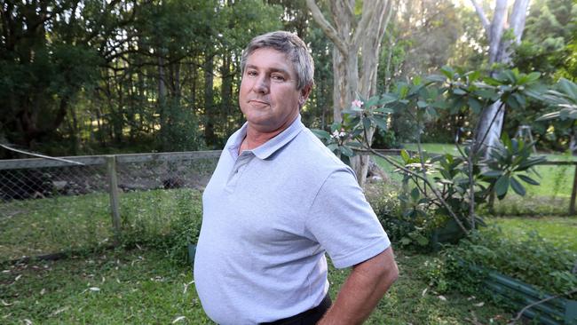 Steve Gresham has one peacock remaining in his back yard after council removed several others following complaints from a neighbour. Photo by Richard Gosling