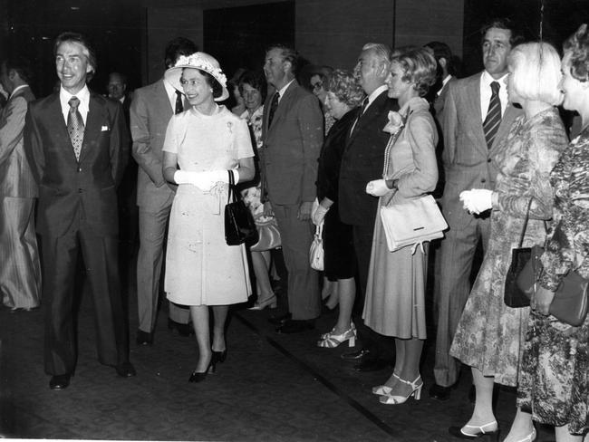 The Queen walks with SA Premier Don Dunstan in the foyer of the Adelaide Festival Theatre.
