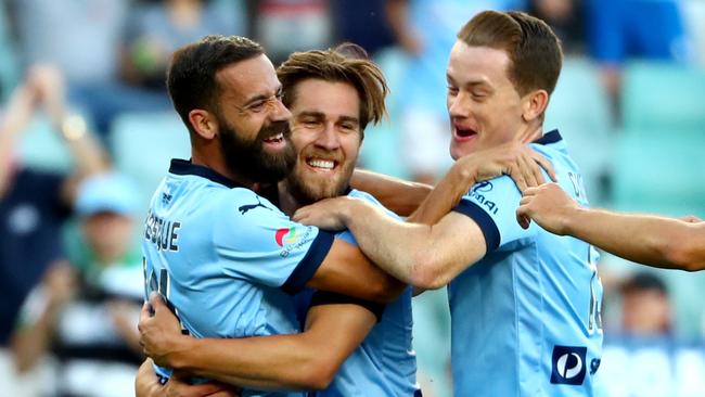 Sydney's Alex Brosque is swamped by teammates after scoring a goal at Allianz Stadium. Picture: Gregg Porteous