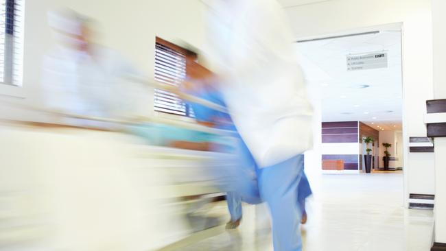 Hospital staff rushing a patient off to theatre in urgency Emergency ward. Picture: istock