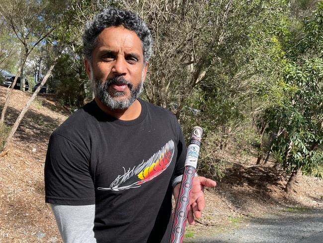 Preston Campbell with Alberton Ormeau's Aboriginal artwork middle stump, designed by himself.