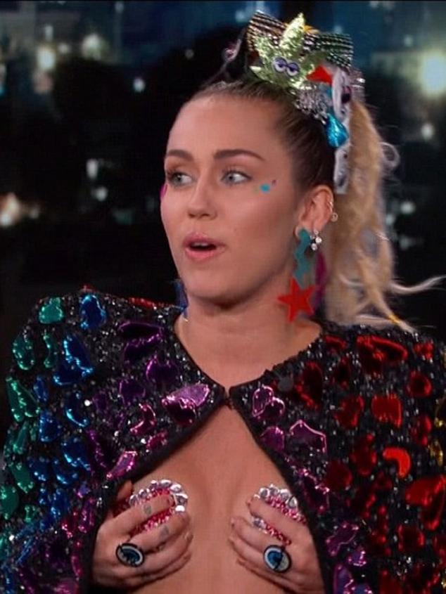 'I'm a little cold. I should've worn a shirt,' says Miley as she sits down for a chat. Picture: Jimmy Kimmel Live / ABC