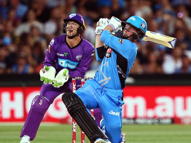 Ben Dunk launches a six during his time with Adelaide Strikers. Picture: Getty Images.