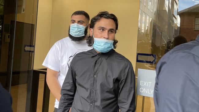 Noah Obeid (front) and Khaled Zreika leave Parramatta Local Court.