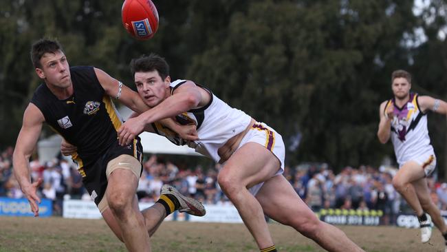 Stuart Hill reels in Balwyn star Jeff Gobbles during his time with Norwood. Picture: Stuart Milligan