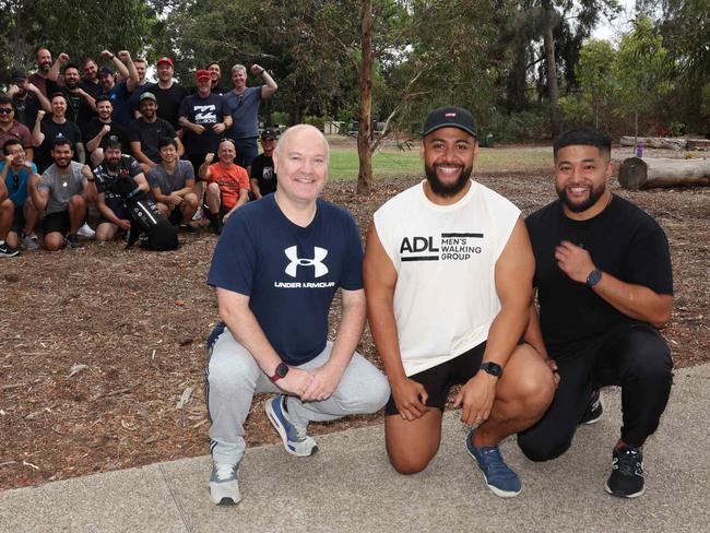 ADELAIDE, SOUTH AUSTRALIA - Advertiser Photos April 19, 2025 - Adelaide Men's Walking group, founders Matthew McCurry, Timani and John Seve, in the foreground of a group of the clubs walkers at Thorndon Park Reserve. Newton. Picture: Emma Brasier