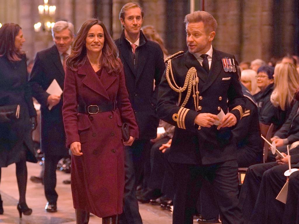 Pippa Matthews and James Matthews with Pippa in a very similar maroon jacket to Kate and Zara. Picture: Kirsty O'Connor/Getty Images