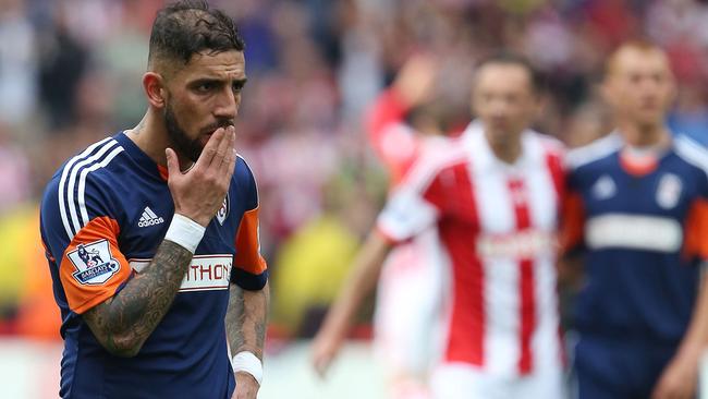 Fulham's Ashkan Dejagah leaves the pitch following defeat and relegation.