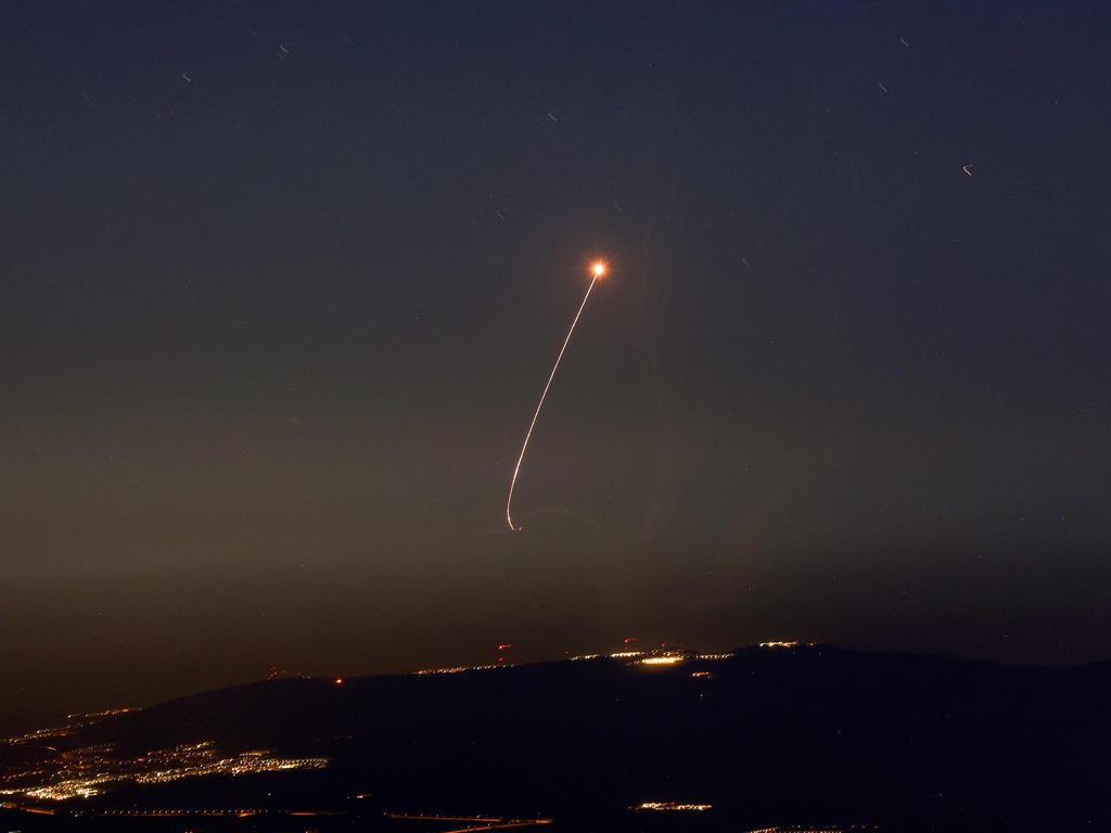 Rockets fired from southern Lebanon are intercepted by Israel's Iron Dome air defence system.