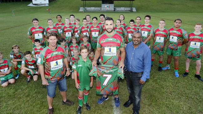 James, pictured here with local juniors in 2018, is a life member of the club and played his first game for the Jets since 2008.