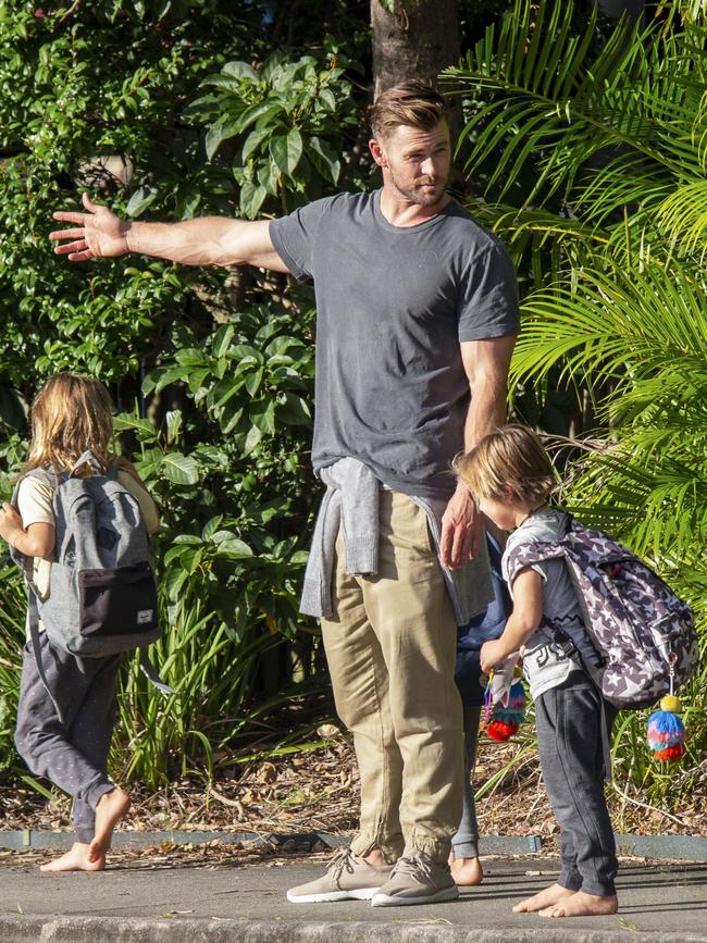 Chris Hemsworth pictured 'extracting' his kids from school after a day of classes in Byron Bay. Picture: Media-mode.com