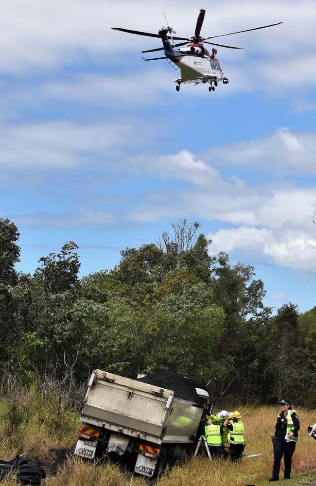 The QGAir Rescue Helicopter arrives as a seriously injured Wright is extracted from his truck. Picture: Cameron Bates