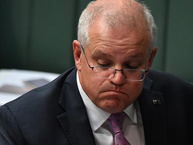 CANBERRA, AUSTRALIA - MARCH 15: Prime Minister Scott Morrison reacts during Question Time in the House of Representatives at Parliament House on March 15, 2021 in Canberra, Australia. Thousands are expected at Ã¢â¬ÅMarch 4 JusticeÃ¢â¬Â rallies across Australia, calling for action against gendered violence in Parliament, as news of the alleged rape of former Brittany Higgins at Parliament House and allegations that Attorney-General Christian Porter raped a 16-year-old gear when he was 17 in 1988 continue to cause outrage. (Photo by Sam Mooy/Getty Images)