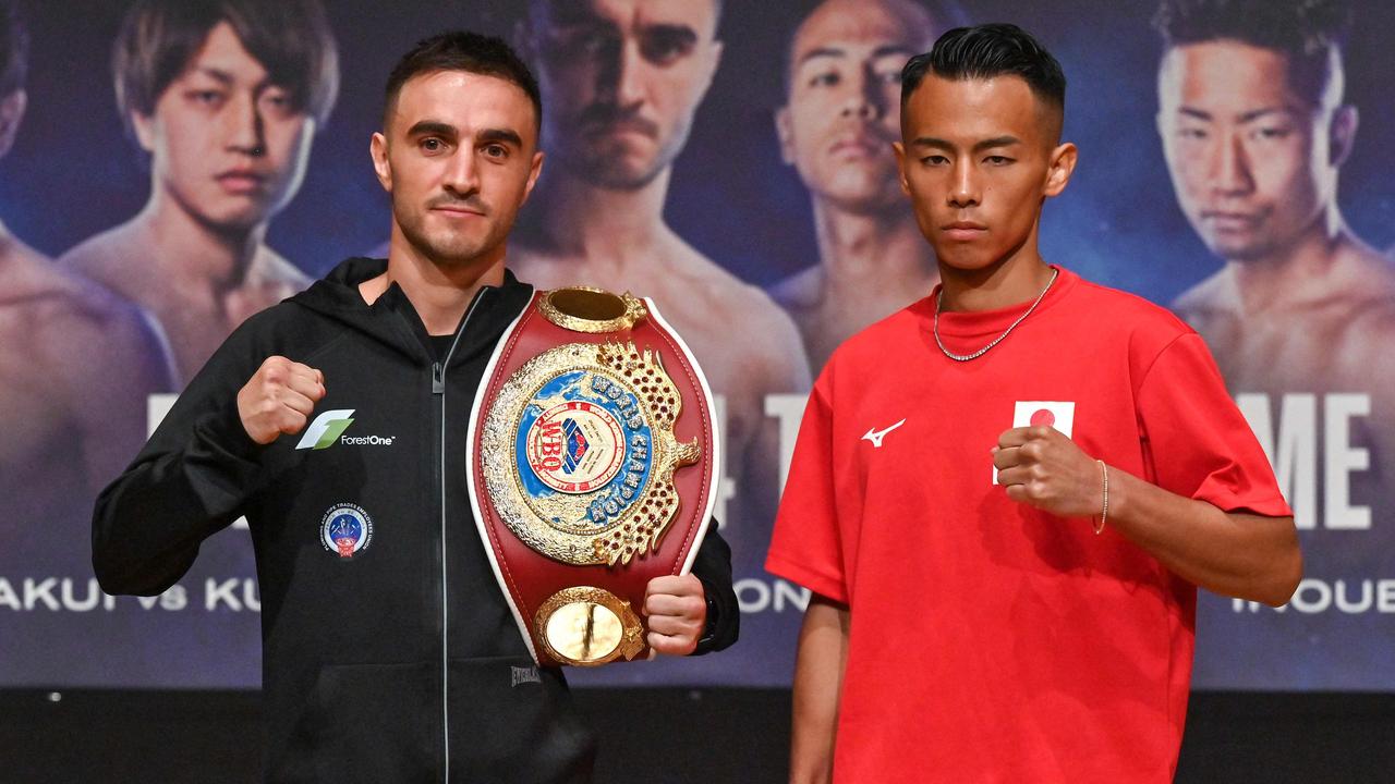 World Boxing Organization (WBO) bantamweight world champion Jason Moloney of Australia (L) poses with opponent Japan's Yoshiki Takei (R) at the end of a pre-fight press conference with other boxers in Yokohama, Kanagawa prefecture, south of Tokyo, on May 4, 2024, two days ahead of their boxing match at the Tokyo Dome. (Photo by Richard A. Brooks / AFP)