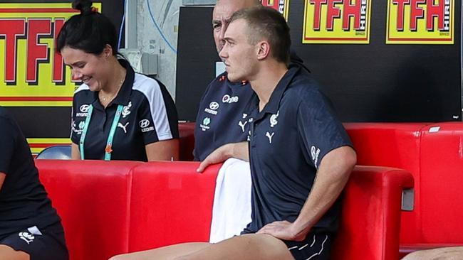 Cripps spends time on the interchange bench after being subbed out of the game. Picture: AFL Photos via Getty Images