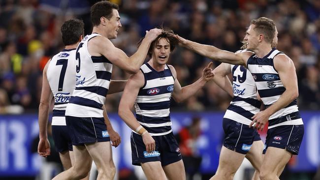 Gryan Miers is congratulated after goaling in Geelong’s onslaught.