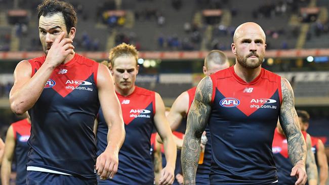 MELBOURNE, AUSTRALIA — MAY 21: Jordan Lewis and Nathan Jones of the Demons look dejected after losing the round nine AFL match between the Melbourne Demons and the North Melbourne Kangaroos at Melbourne Cricket Ground on May 21, 2017 in Melbourne, Australia. (Photo by Quinn Rooney/Getty Images)