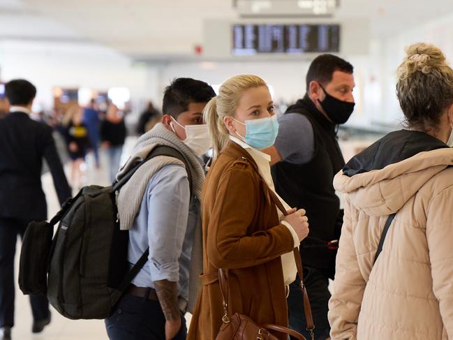 Cassie Sainsbury arriving at Adelaide Airport, with her wife Tatiana (left). Picture: Matt Loxton