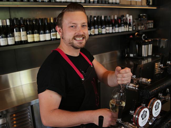 Bartender Oscar Smith pour wine from a tap at the newly opened Chin Chin Sydney.