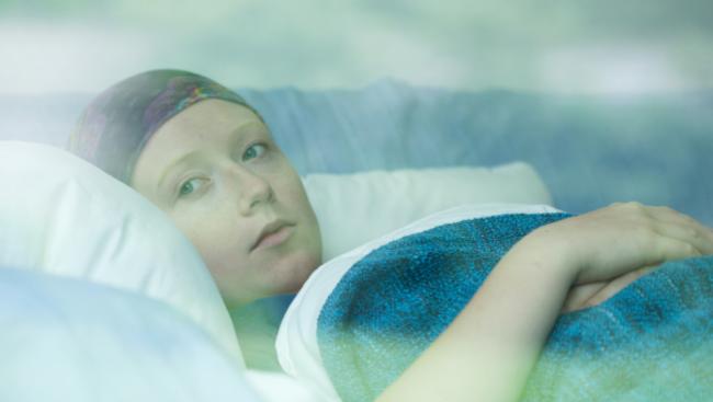 RendezView. Young woman in bed suffering from cancer. (Pic: iStock)