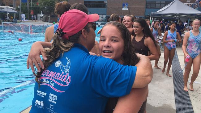 Mermaids coach Nicola Johnson congratulates a St Rita's College player after one of the grand finals at the BWPL decider earlier this year.