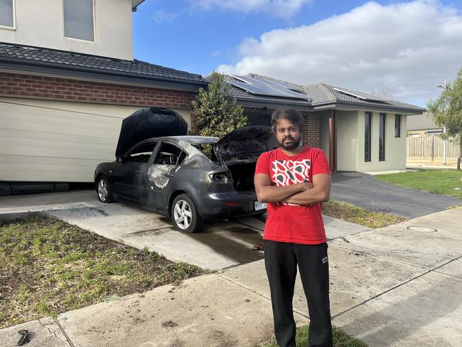 Daniel Dinesh rushed out with a hose after he saw the flames. Picture: Nilsson Jones