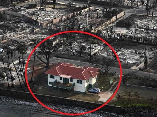 The single house remains untouched amidst the rubble.