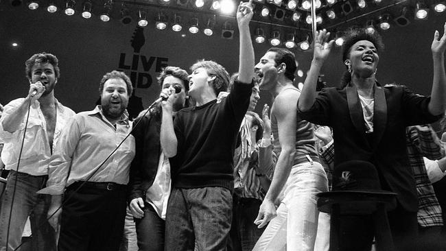 George Michael, Harvey Goldsmith, Bono, Paul McCartney, Bob Geldof and Freddie Mercury in the finale of Live Aid at Wembley Stadium in 1985. Picture: AP