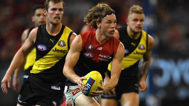 Jayden Hunt on the charge against the Tigers on Anzac Day eve, a fixture the Demons have retained. Picture: AAP