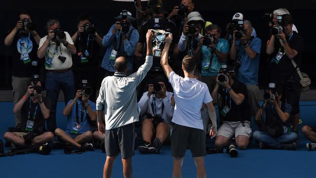 Rajeev Ram (L) and Joe Salisbury pose with the winners' trophy. Picture: John Donegan/AFP