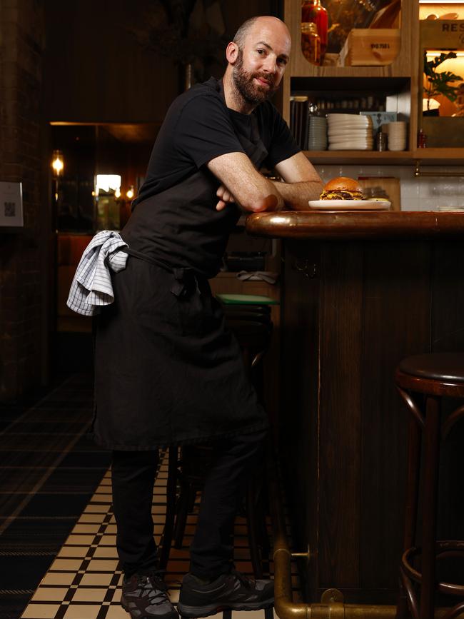 Chef Pip Pratt with the Gidley Burger at The Rover in Surry Hills which has been named as Australia's best burger. Picture: Jonathan Ng