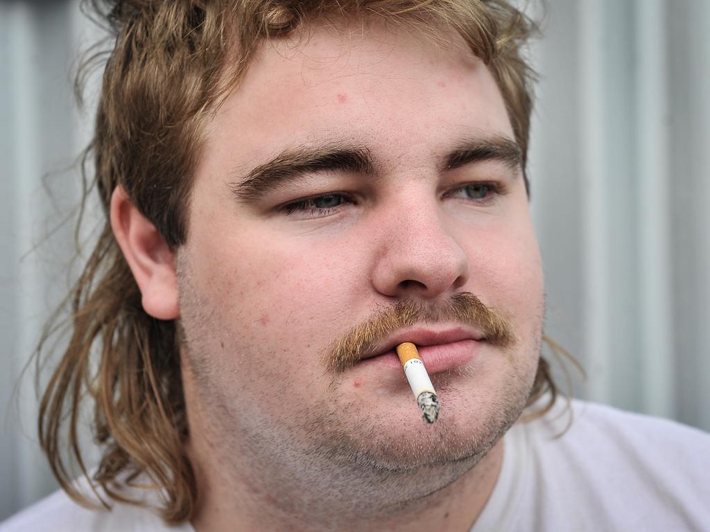 Kelsley Manns is seen during Mulletfest, a special event designed to celebrate the hairstyle that's all about business at the front, party at the back, Chelmsford Hotel, Kurri Kurri. (AAP Image/Perry Duffin) 