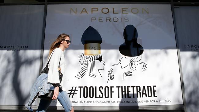 The Napoleon store in Double Bay has new shop artwork, showing a woman smoking below a sign saying "education is everything". Picture: Jonathan Ng