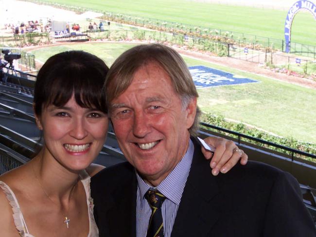 John Singleton with Julie at Morphettville Racecourse for a Magic Millions meeting.