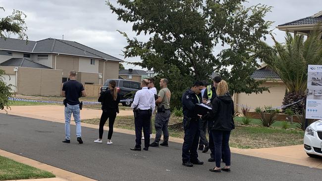 A man was left lying in the middle of the street after reportedly being shot in the face in Point Cook, as police hunt a shooter who remains at large. Picture: Alanah Frost