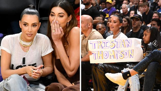 Kim Kardashian holds a sign supporting Tristan Thompson. Copyright 2023 NBAE. Photo by Andrew D. Bernstein/NBAE via Getty Images.