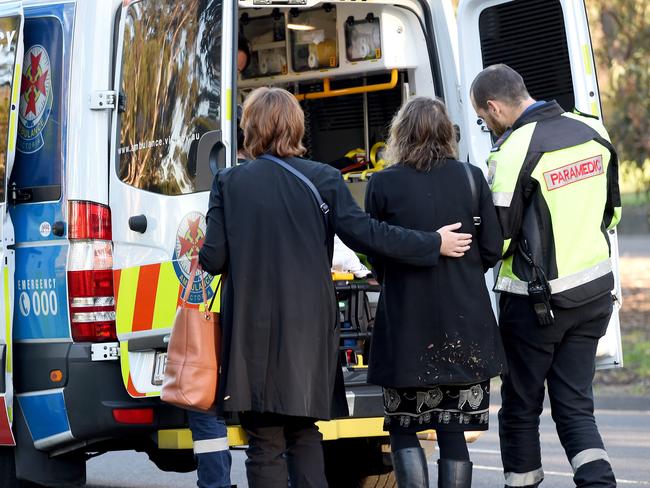 An injured passenger walks to the ambulance to be treated. Picture: Nicole Garmston.